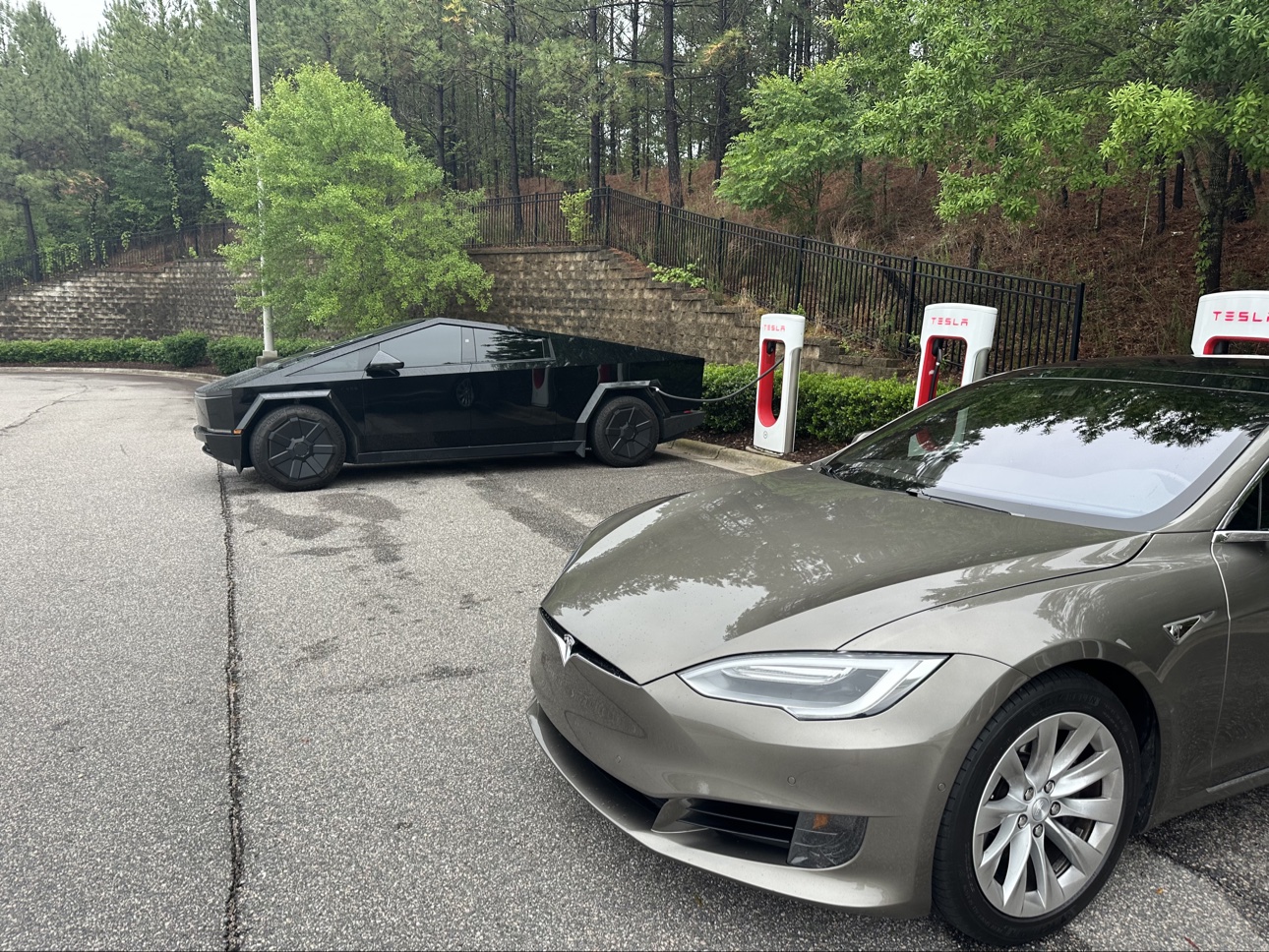 Tesla vehicles at a charging station